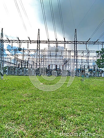 The green grass is accompanied by a very neat PLN substation network. PLN main substation system Stock Photo
