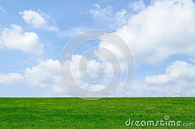 Green Grass, Blue Sky Background Stock Photo