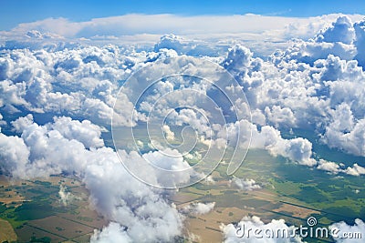 Green grass fields, forests, blue sky and white cumulus fluffy clouds background panoramic aerial view, sunny summer landscape Stock Photo
