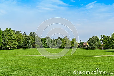 Green grass green trees in beautiful park white Cloud blue sky in noon. - Image Stock Photo