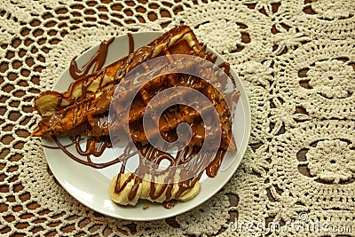 Green grass in the morning dew, beautiful summer background in the open air. Green herbal background.Waffle cake with chocolate an Stock Photo