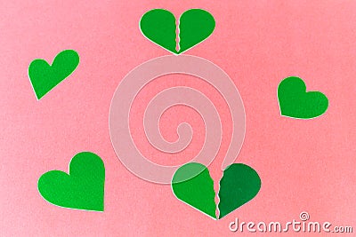 Green hearts on a gently pink backround- copy space Stock Photo