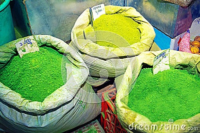 Green henna powder in bags, on souk market in Muscat Stock Photo