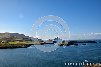 Green hilly coast and island in Ireland on the Atlantic coast in Ring Of Kerryy Stock Photo