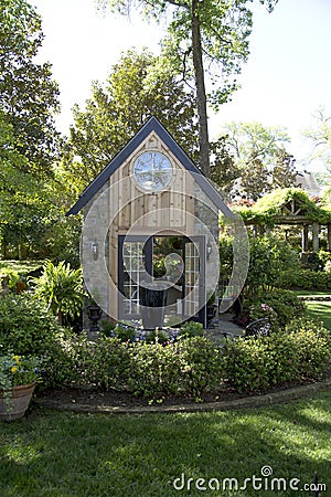 Green house in back yard Stock Photo