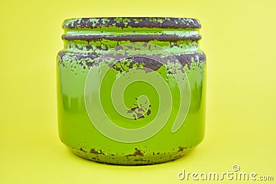 Green jar. Rusty tin view, ceramic jar. Stock Photo