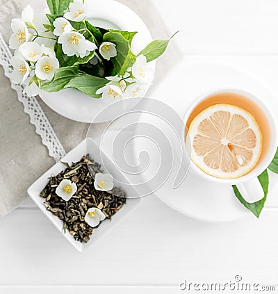 Green jasmine tea, jasmine petals, topview Stock Photo