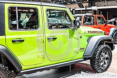 Green Jeep Wrangler Rubicon at Brussels Motor Show, four-wheel drive off-road vehicle manufactured by Jeep Editorial Stock Photo