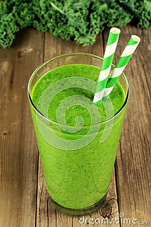 Green kale smoothie on wood background Stock Photo