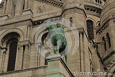 Green knight like sculpture outside of the Basilica of the Sacred Heart of Paris Editorial Stock Photo