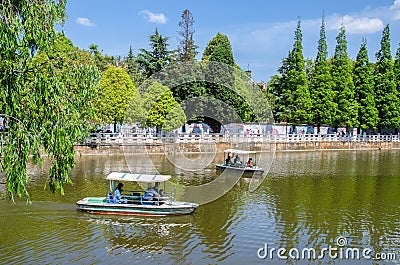 Green Lake Park also known as Cui Hu Park is one of the most beautiful parks in Kunming city. Editorial Stock Photo