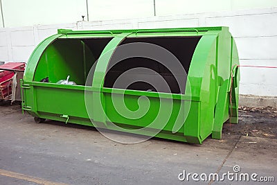 green large metal recycling dumpster, Rusty old dumpster behind Stock Photo