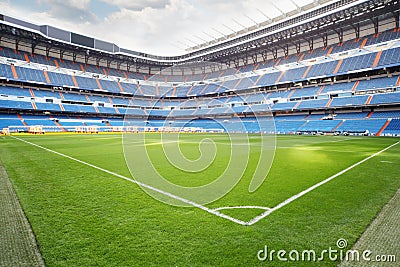 Green lawn with marking at empty outdoor football stadium Stock Photo