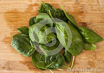 Green leaf salad Spinach on wood desk bamboo nature vegan Stock Photo