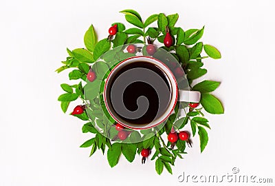 Green leaves and red berries, flowers, Cup of coffee on a white Stock Photo