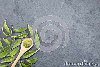 Green leaves and stevia powder - Stevia rebaudiana. Top view Stock Photo