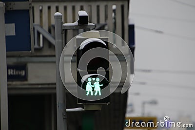 A green led pedestrian light depicting two women holding hands Stock Photo