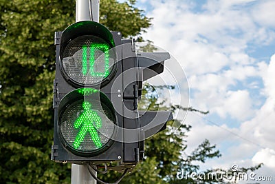 Green light at traffic lights for pedestrians. Stock Photo