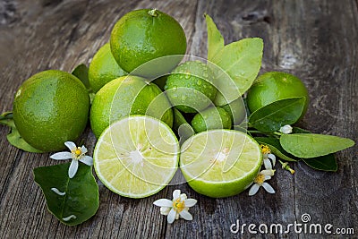 Green lime lemon on wood Stock Photo