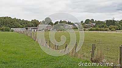 Fields with farms and houses and forests in the Wallonian countryside Editorial Stock Photo