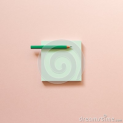 Green memo paper, sticky notes with colored pencil on pink background Stock Photo