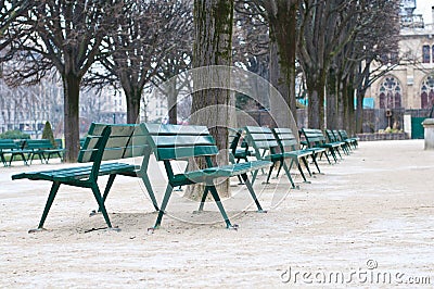 Green metal chairs in the garden in winter season Stock Photo