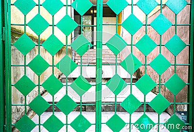 Green metal doors. Rhombic pattern. Old vintage style Stock Photo