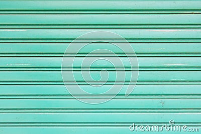 Green metallic roller shutter door for wallpaper Stock Photo