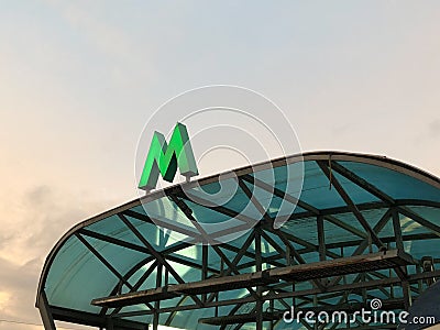 Green metro sign on the visor of entrance Stock Photo