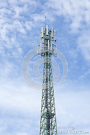 Green mobile phone pole with blue sky and cloud Stock Photo