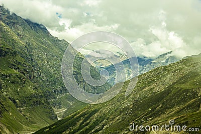 A green mountain canyon with a river and clouds Stock Photo