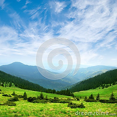 Green mountain valley and sky Stock Photo