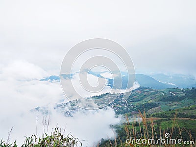 green mountain with village and white fog Stock Photo