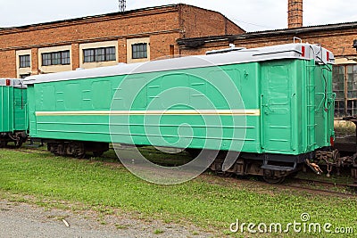 Green narrow-gauge railway wagon Stock Photo