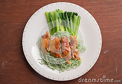 Green noodle with duck meet and vegetable wood table Stock Photo