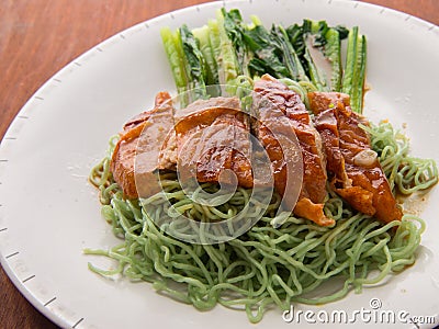 Green noodle with duck meet and vegetable wood table Stock Photo