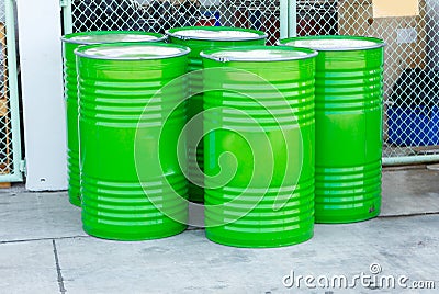Green oil drums on an industrial site Stock Photo