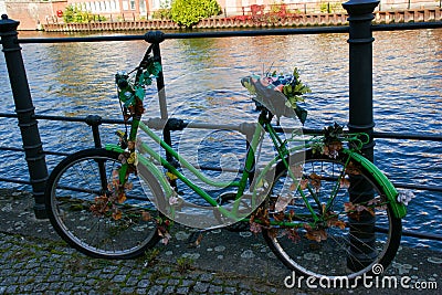 a green old bike turned into artwork Stock Photo