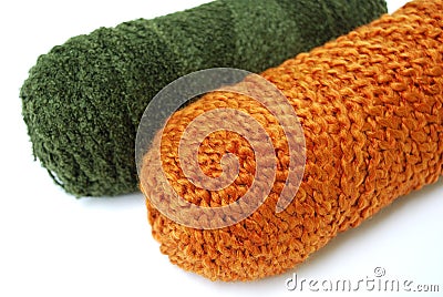 Green and orange yarn rolls Stock Photo