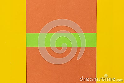 Green, Orange and Yellow coloured paper background Stock Photo