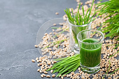 Green organic wheat grass juice. Morning drink. Superfood concept. Stock Photo