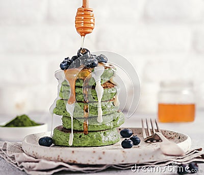 Green pancakes with matcha tea Stock Photo