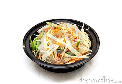 Thai papaya salad, Som Tum from Thailand served in black bowl on white background. topping with peanuts. Stock Photo