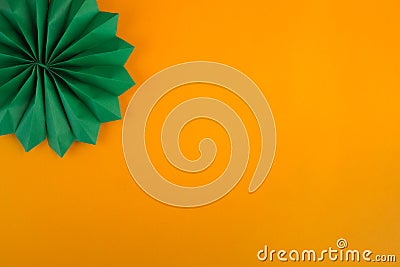 Dark green decorative paper cigar on an orange textured background Stock Photo