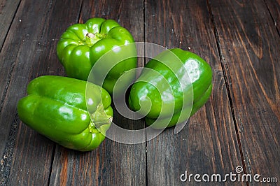 Green paprika on wood background. close up Stock Photo