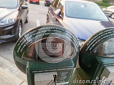 A Green Parking meter in Birmingham, Michigan Editorial Stock Photo