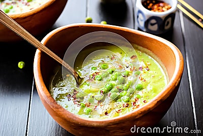 Green Pea Soup with Red Pepper Stock Photo