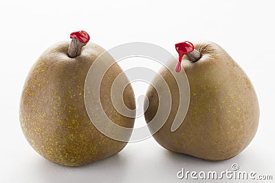 Green pears with red sealing wax Stock Photo