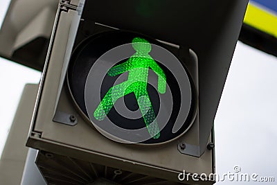 Green pedestrian light at a pedestrian crossing Stock Photo