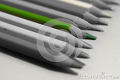 Green pencil on a background of colorless close-up. Stock Photo